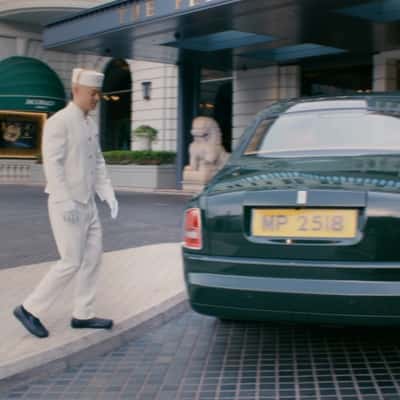 Balloons Float From Car Trunk in a fake-out-of-home ad of The Peninsula