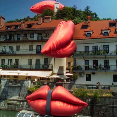 Tied Inflatable Lips Above Boat in a fake-out-of-home ad of Smile