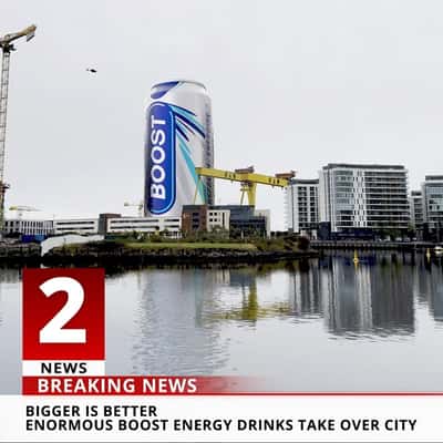 Towering Cans Spotted Around the City in a fake-out-of-home-ad of Boost Drinks