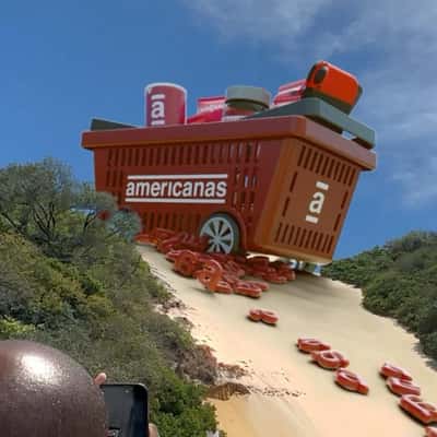 Grocery Basket Stuck on Sand Dunes in a fake-out-of-home ad of Americanas