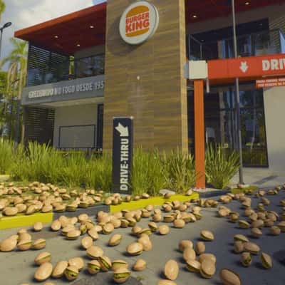 Pistachio Nuts Raining at Restaurant in a fake-out-of-home ad of Burger King