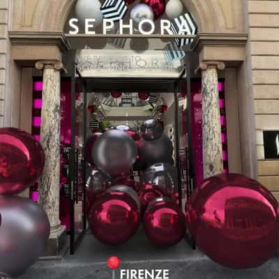 Christmas Balls Roll in Different Streets in a fake-out-of-home ad of Sephora