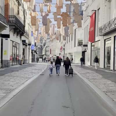 Baby Clothes Hanging Above Shopping Street in a fake-out-of-home ad of HEMA