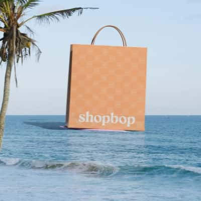 Shopping Bag Drags by a Speedboat in a fake-out-of-home ad of Shopbop
