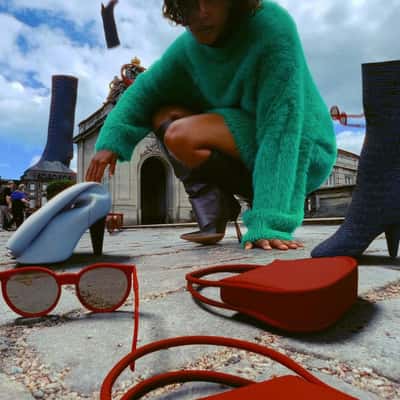 Fashion Items Rain Down in a fake-out-of-home ad of Shopbop