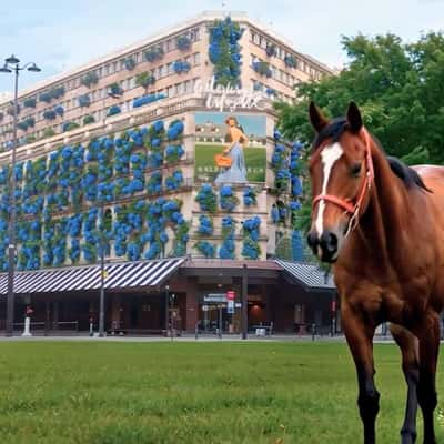Blue Flowers Bloom on Façade in a fake-out-of-home ad of Galeries Lafayette