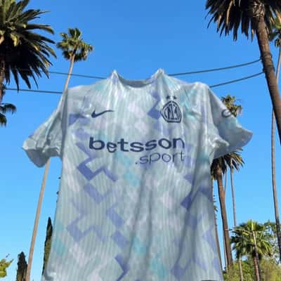 Jerseys Hanging in Palm Trees in a fake-out-of-home ad of Inter