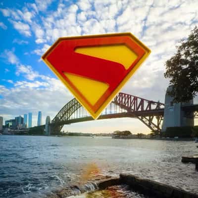 Glowing Logo Rises from Harbour in a fake-out-of-home ad of Superman