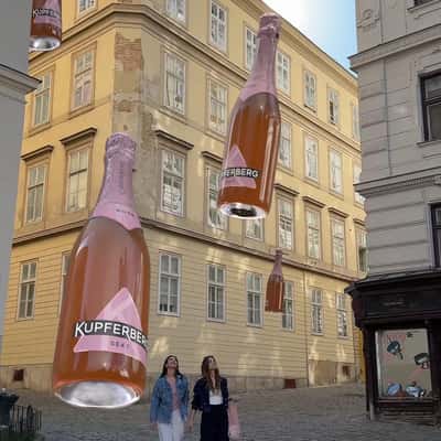 Woman Grabs Floating Wine in a fake-out-of-home ad of Kupferberg Sekt
