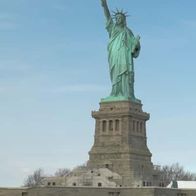 Pixelated Statue of Liberty on Screen in a fake-out-of-home ad of WhatsApp
