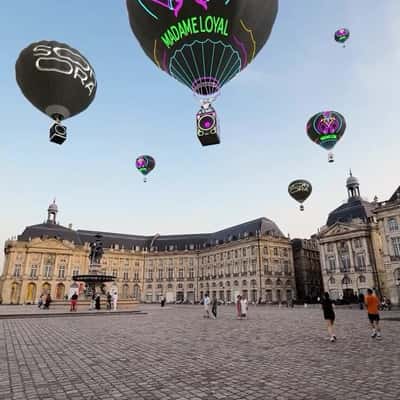 Hot Air Balloons Glide Above Paris in a fake-out-of-home ad of Madame Loyal Festival