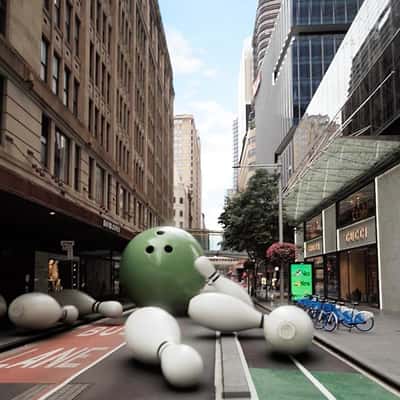 Bowling Ball Strikes Pins on the Street in a fake-out-of-home ad of The Commons
