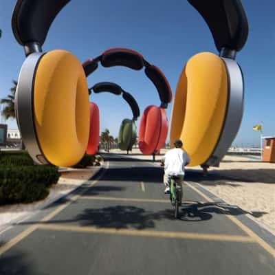 Bikers Race under Headphone Tunnel in a fake-out-of-home ad of Dyson