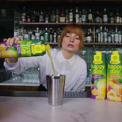 Fruits Emerge from Cup to City in a fake-out-of-home ad of Rauch Happy Day