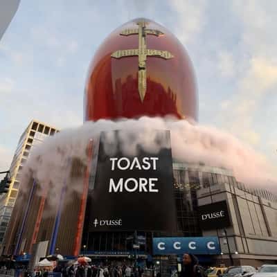 Cognac Bottle Ascends at Arena in a fake-out-of-home ad of D’USSÉ