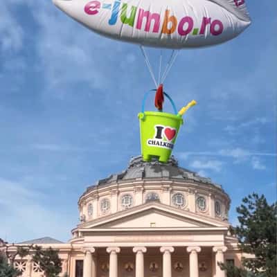 Lip Balloon Carries Bucket with Shovels in a fake-out-of-home ad of Jumbo