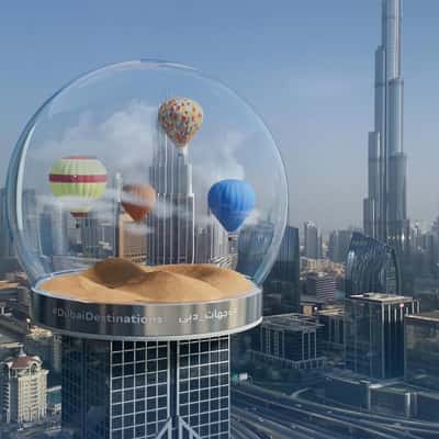 Tourist Spots Inside Glass Globe in a fake-out-of-home ad of BrandDubai
