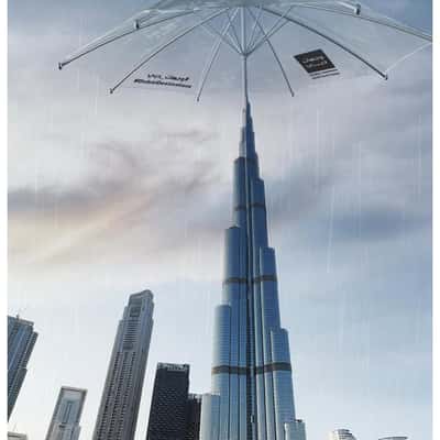 Clear Umbrella Opens Above the Building in a fake-out-of-home ad of BrandDubai
