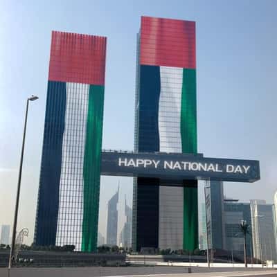 Tower Glass Windows Flip Displaying Flag in a fake-out-of-home ad of BrandDubai