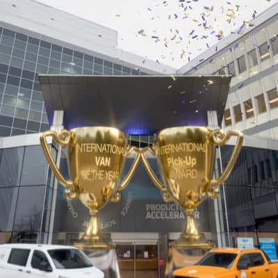 Golden Trophies Unveiled at Ford Building in a fake-out-of-home ad of Ford