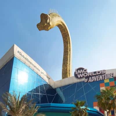 Dinosaur Peeks Above the Adventure Park in a fake-out-of-home ad of BrandDubai