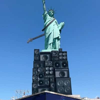 Guitar Hangs on Statue of Liberty in a fake-out-of-home ad of Lenny Kravitz 