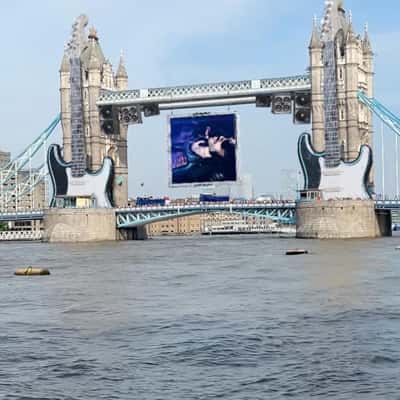Electric Guitars on Tower Bridge in a fake-out-of-home ad of Lenny Kravitz
