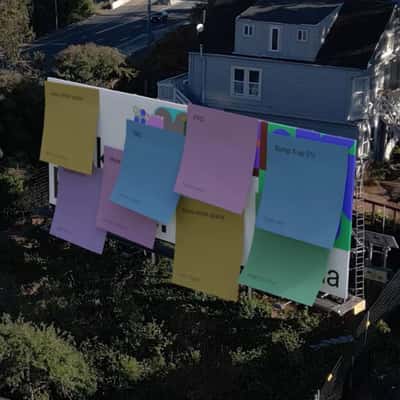 Billboards Covered with Stick Notes in a fake-out-of-home ad of Figma