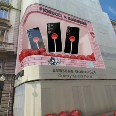 Lollipop and Phone Emerge on Digital Screen in a fake-out-of-home ad of Samsung