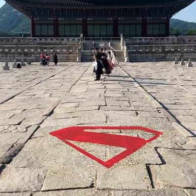Logo Appears on Cobblestone Street in a fake-out-of-home ad of Superman