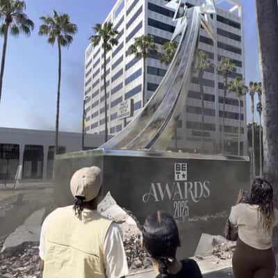 Trophy Emerges On Sidewalk in a fake-out-of-home ad of BET