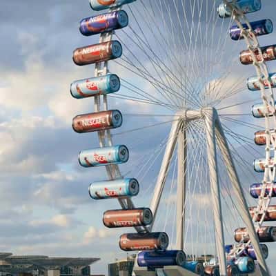 Coffee in Cans as Ferris Wheel Carts in a fake-out-of-home ad of Nestlé