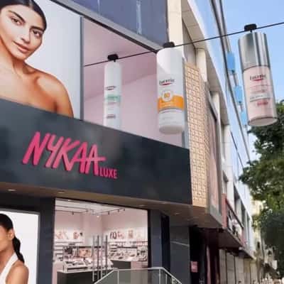 Facial Products Glide on Cable Line in a fake-out-of-home ad of Nykaa