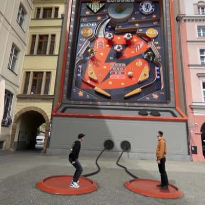 Pinball Game on Building Wall in a fake-out-of-home ad of Betano