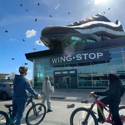 Raining Running Shoes in a fake-out-of-home ad of JD Sports