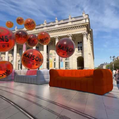 Sofas Colored by Tangerine Bubbles in a fake-out-of-home ad of Maisons du Monde