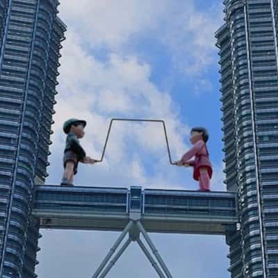 Giant Dolls Swinging Metal Rope in a fake-out-of-home-ad of Netflix