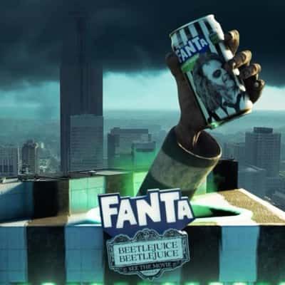 Flying Train on Skyscraper in a fake-out-of-hand of Fanta