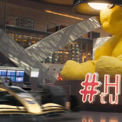 F1 Car Zooms at Airport Terminal in a fake-out-of-home ad of Duty Free 