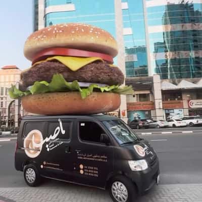 Burger Above Delivery Van in a fake-out-of-home ad of Aseel Restaurant