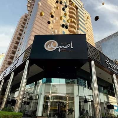 Balloons Floats from Cafe in a fake-out-of-home ad of Aseel Restaurant
