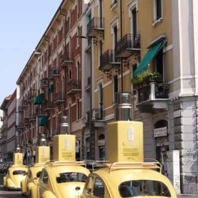 Lotion Bottles Mounted on Beetle Cars in a fake-out-of-home ad of Clinique