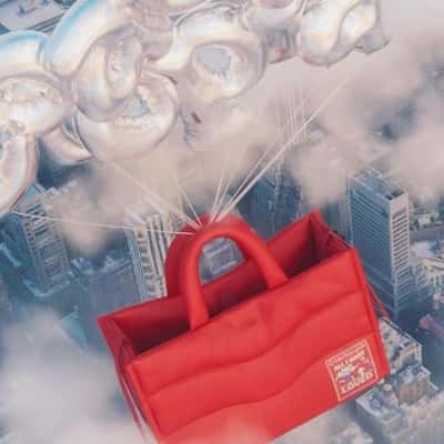 Tote Bags Float on Letter Balloons in a fake-out-of-home ad of Coachtopia
