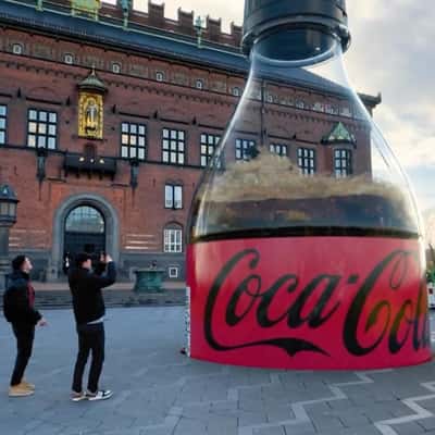 Ground Trembles as Bottle Emerges in a fake-out-of-home ad of Coca-Cola