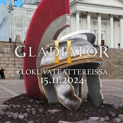 Leffamaailma Gladiator Helmet Burst from Ground in a fake-out-of-home ad of Leffamaailma