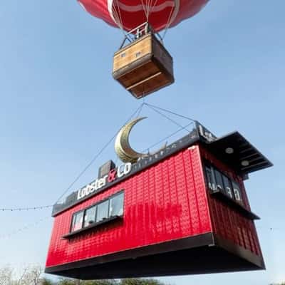 Hot Air Balloon Lifts Off Food Stall in a fake-out-of-home ad of Lobster & Co