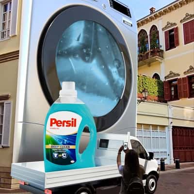 Washing Machine Releases Flowers in a fake-out-of-home ad of Persil