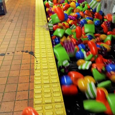 Candies Rushing on Subway in a fake-out-of-home ad of Candy Crash Saga