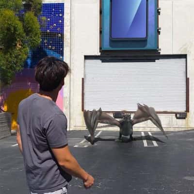 Dragon Emerges from Phone Screen in a fake-out-of-home ad of Samsung Galaxy