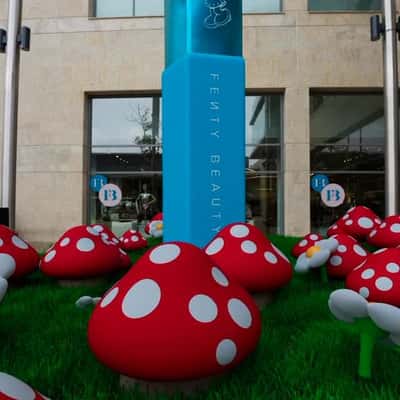 Smurf Village at Brown Thomas in a fake-out-of-home ad of Fenty Beauty